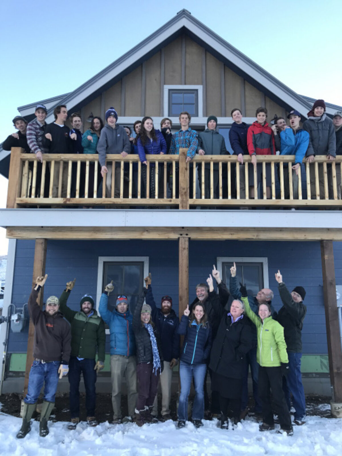 SOAR students in front of the home they designed and built